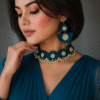 Woman wearing blue floral handmade choker necklace set with matching earrings and pearl detailing