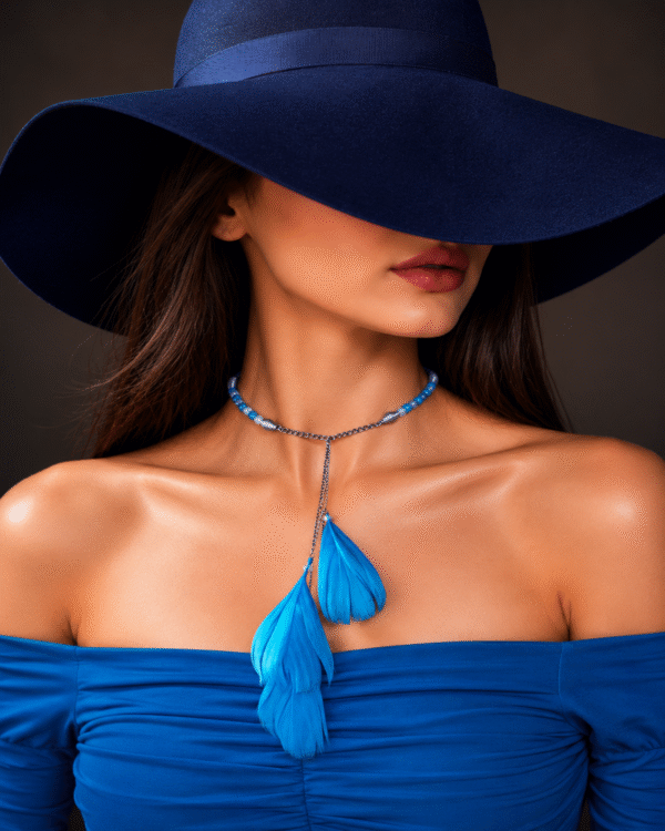 Woman wearing blue feather choker necklace set with stylish modern fashion look and wide hat main