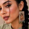 closeup of green handmade earrings for girls