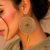 Handmade boho jute earrings with gold leaf charm closeup