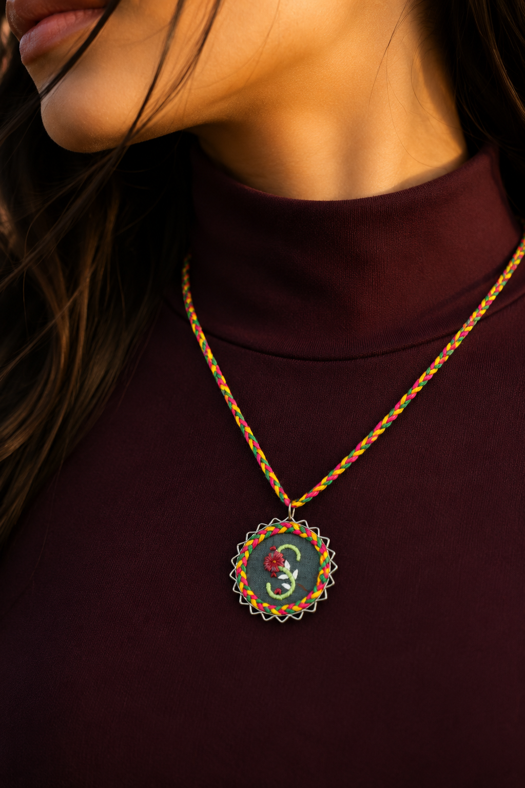Handmade Initial Pendant Necklace featuring a floral embroidered letter S with a colorful braided cord
