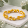 Handmade yellow beaded bracelet with crystal accents.