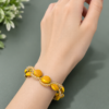Handmade yellow beaded bracelet with crystal accents