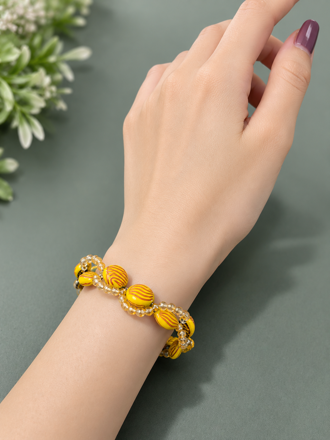Handmade yellow beaded bracelet with crystal accents