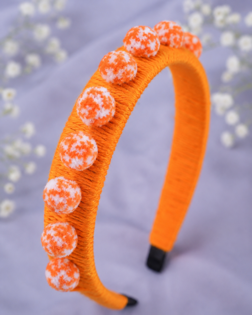 Handmade orange pom pom hair band with soft wool wrapped headband for women and girls by GALORIA, perfect for casual, party and festive wear.