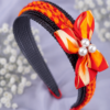 Handmade red and orange braided hair band with ribbon bow and pearl embellishments for women and girls by GALORIA, perfect for casual, party and festive wear.